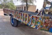 Messey 240 tractor with 18 ft 4-wheel Trolly